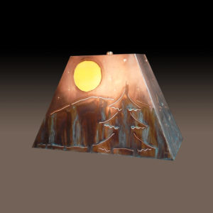 Western Style Copper Lamp Shade with Mountain Ever Green design under moon light. Rolling hills in background, sides have smaller tree design